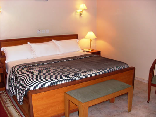 /web/uploads/116/Welcome Centre Hotels/room-photos/Standard room (Double Occupancy: 67050)/Standard-Room-Bedroom.jpg